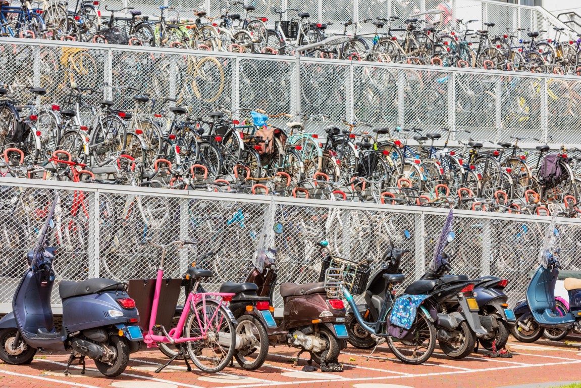 Multi level outdoor bicycle and scooter parking near a trainstation in Alkmaar Netherlands